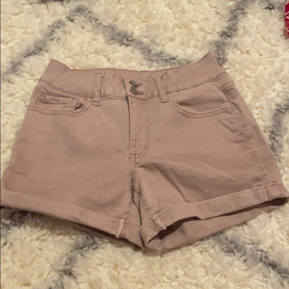 Light pink jean shorts.